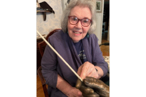 Solti's assistant Evanstan resident Elizabeth Buccheri holding a bow signed for her by Georg Solti.