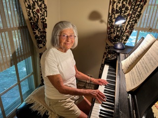 Gloria Boyell at her piano.